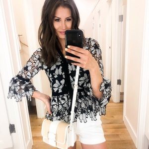 Embroidered floral crochet peplum top.